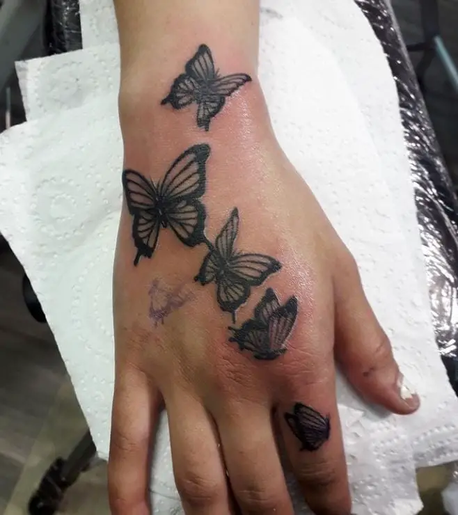 black butterfly hand tattoos