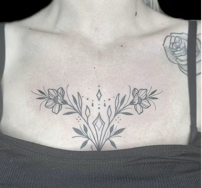 black floral chest tattoo