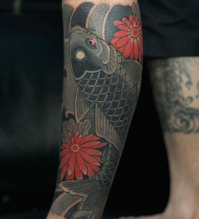 black, grey and red koi fish tattoo