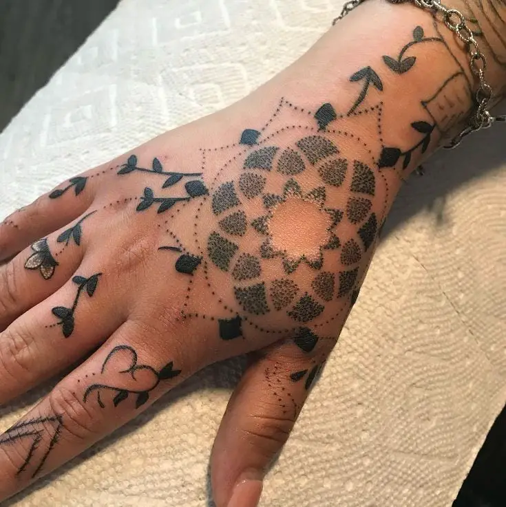 black mandala hand tattoo