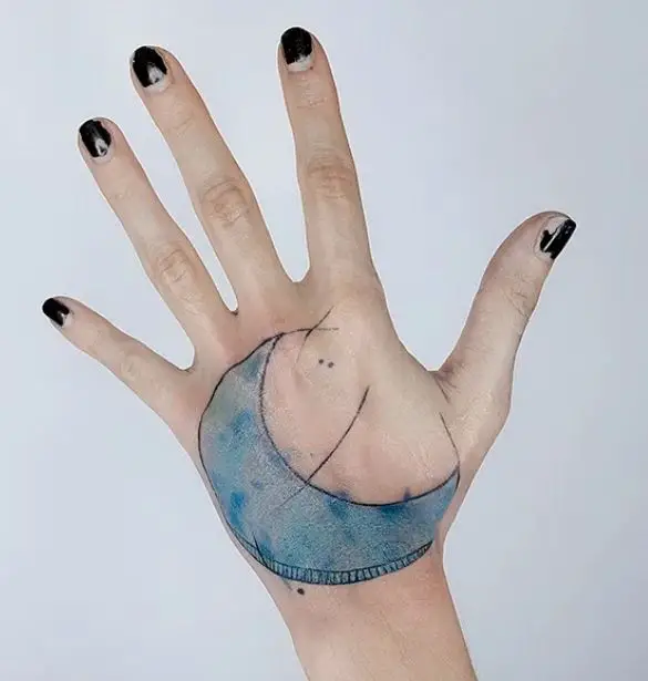 blue moon hand tattoo