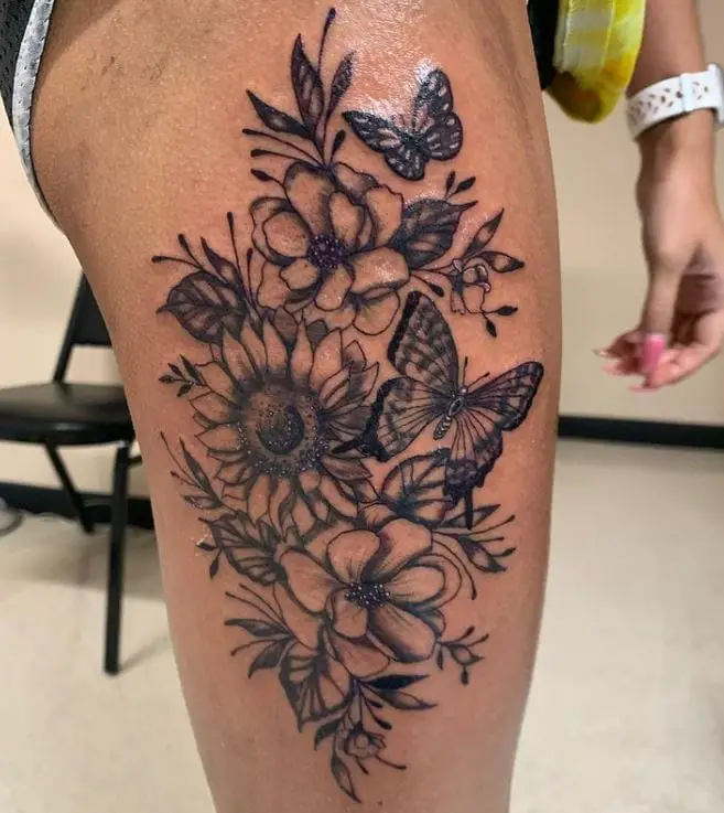 butterfly floral tattoo on the thigh