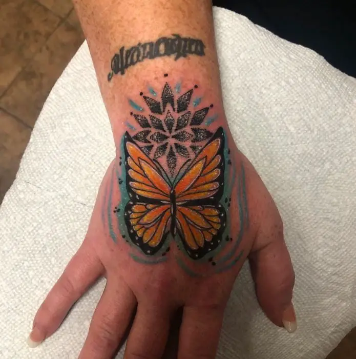 butterfly hand tattoo in colour