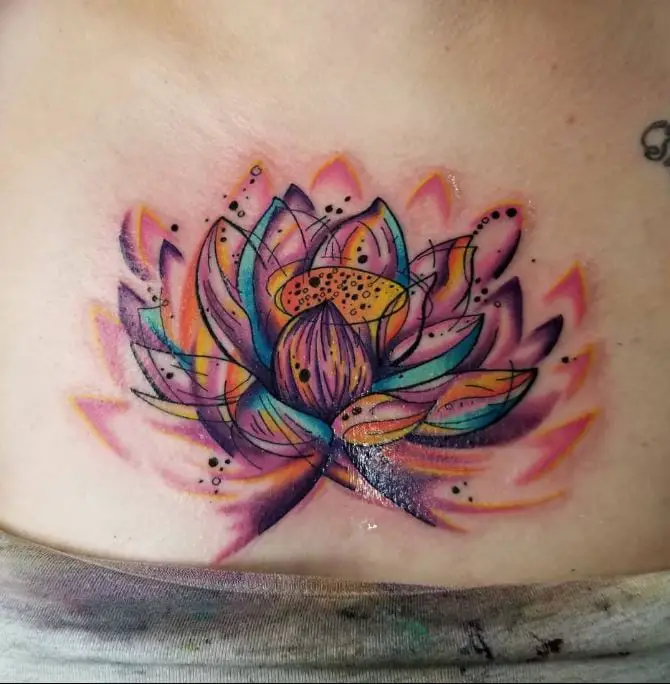 coloured lotus chest tattoo