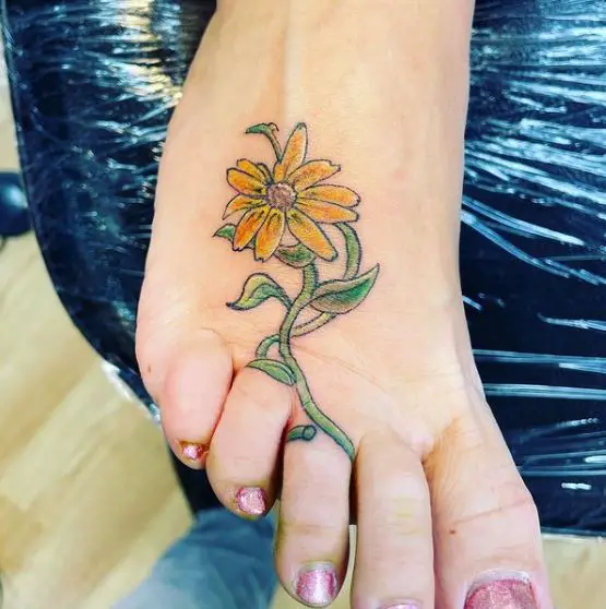 coloured sunflower tattoo on the foot