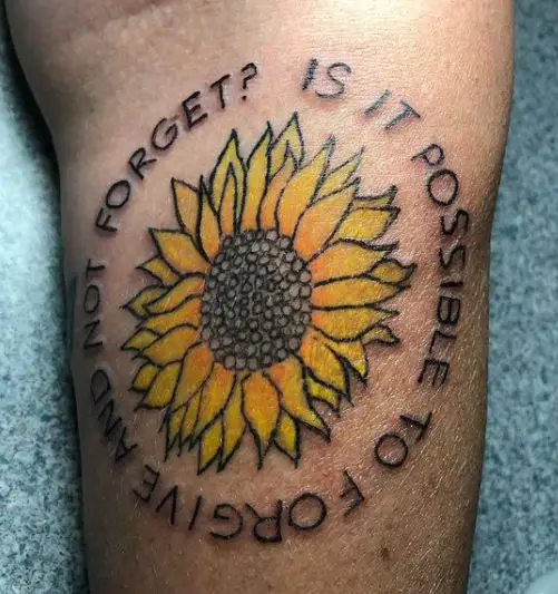 colourful sunflower tattoo with wording around it