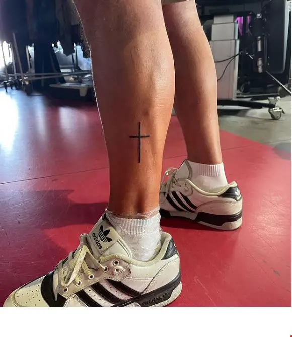 cross tattoo on the leg