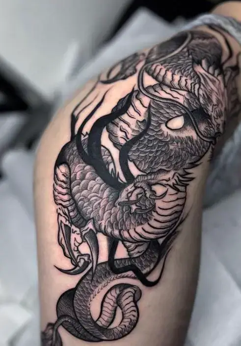 dark dragon tattoo with thick lines and shading