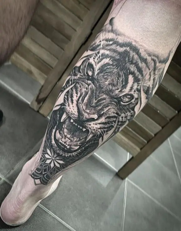 detailed lion leg tattoo