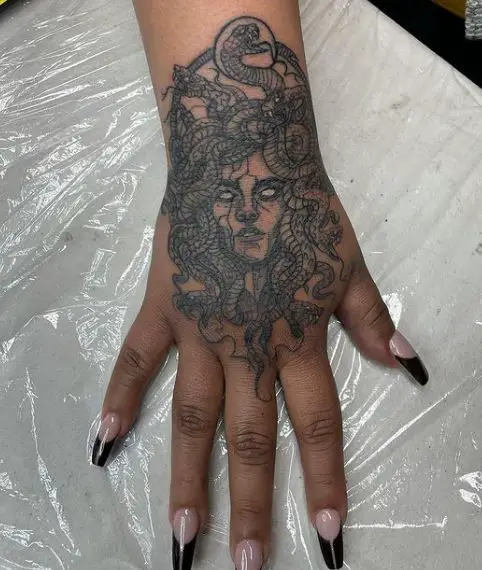detailed medusa hand tattoo