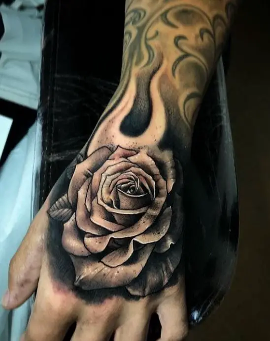 detailed rose hand tattoo