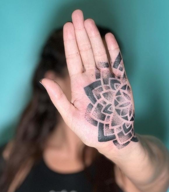 dot work mandala palm tattoo