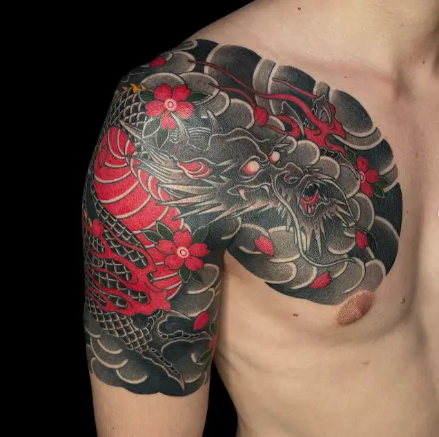 dragon tattoo with bold colours and flowers