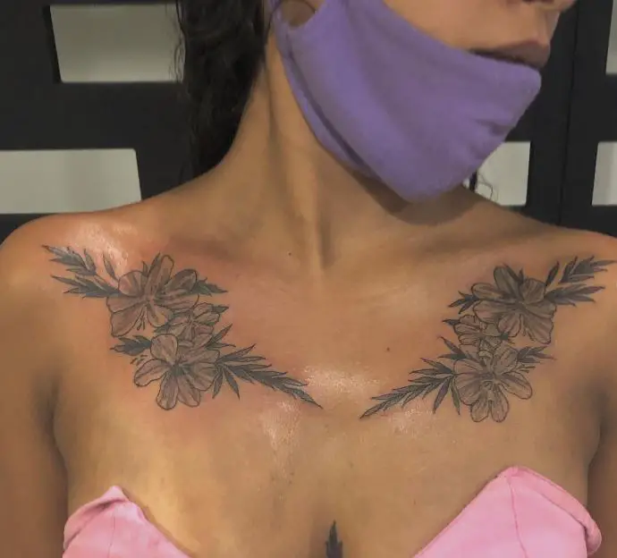 fine line floral chest tattoo