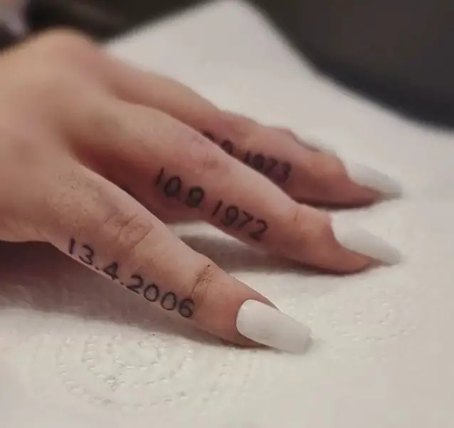 finger tattoos of different dates