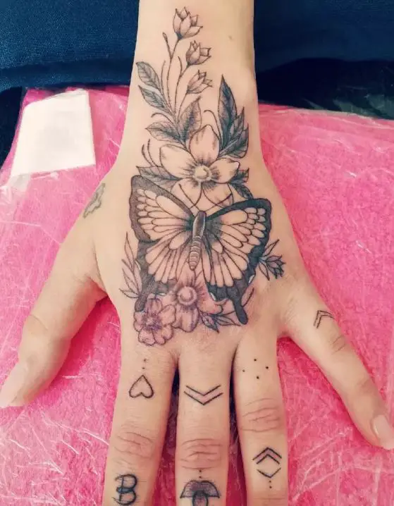 floral and butterfly hand tattoo