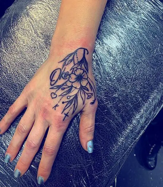floral hand tattoo with initials