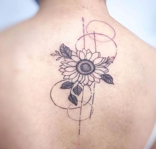 geometric sunflower tattoo on the back