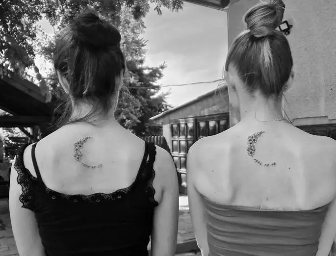 half crescent sister tattoos with flowers
