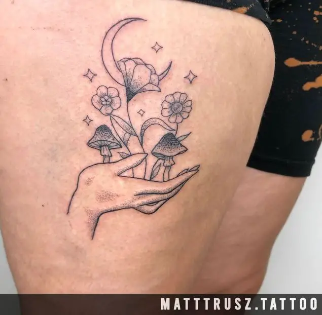 hand flowers, moon and stars tattoo