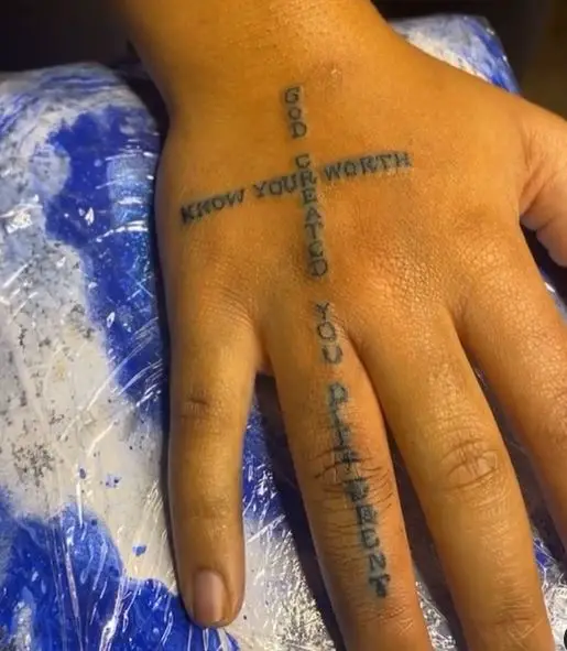 hand tattoo with a wording