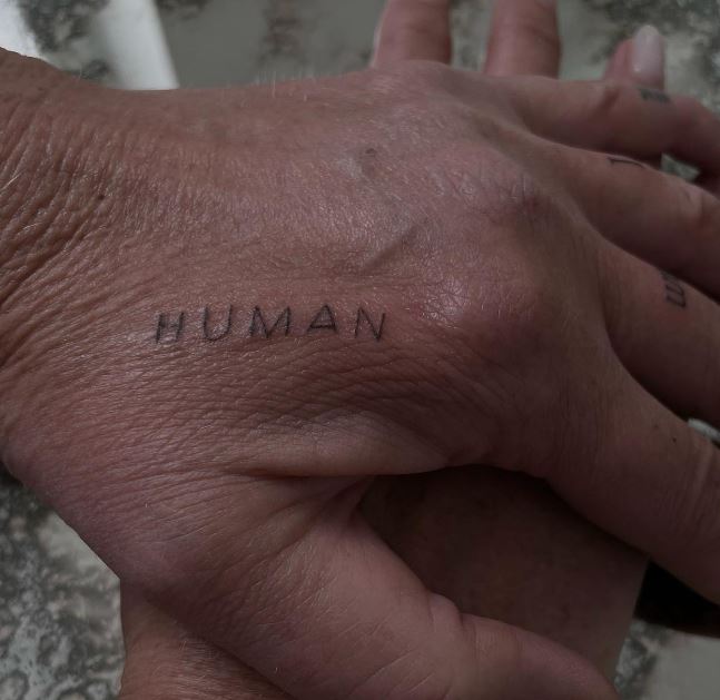 human word hand tattoo