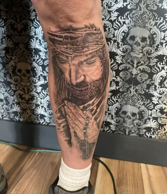 jesus leg tattoo