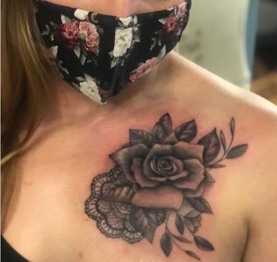 large black rose chest tattoo