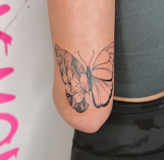 large butterfly tattoo on the hand