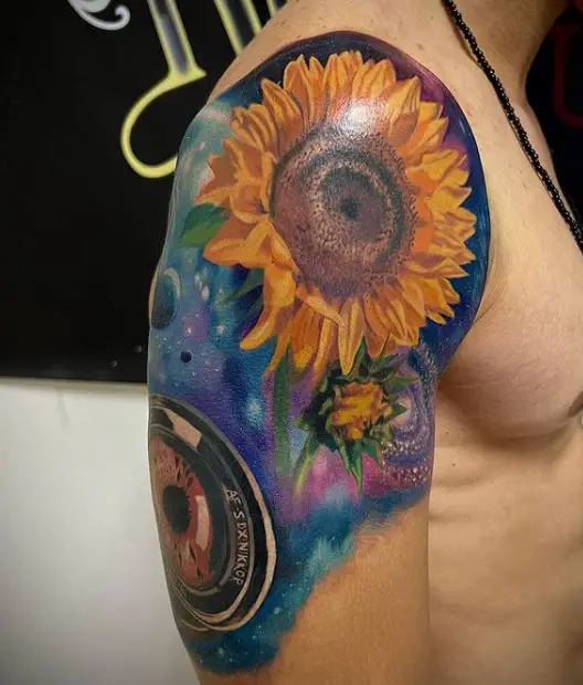 large colourful sunflower tattoo on the hand