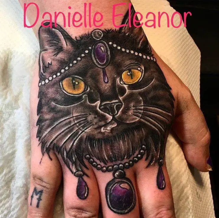 large detailed cat hand tattoo