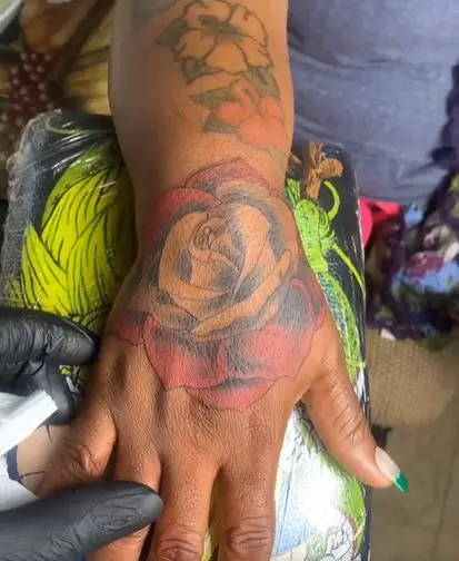 large floral tattoo on the hand