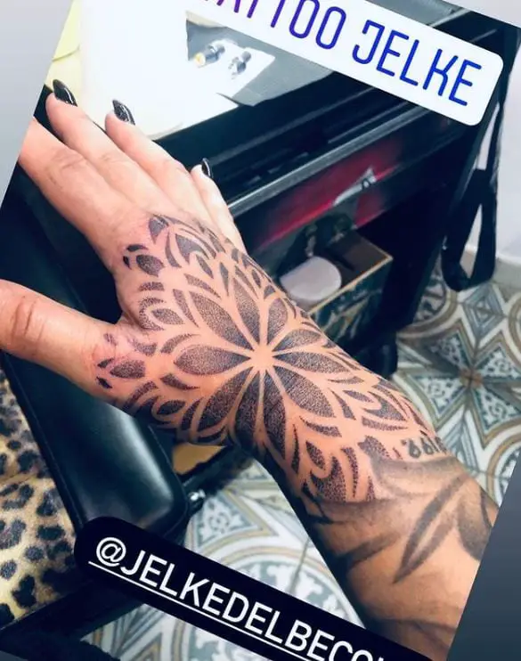 large mandala hand tattoo