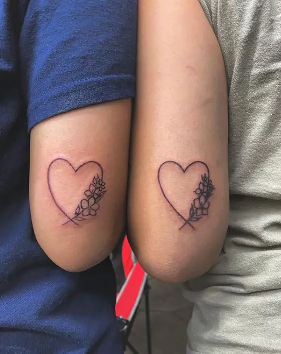 large matching heart tattoos with flowers