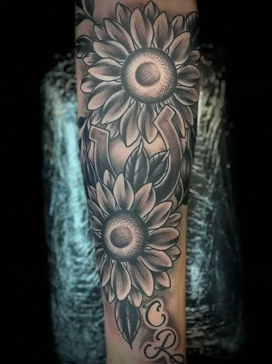 large sunflower tattoo on the arm