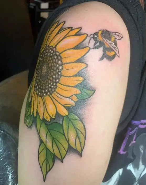 large sunflower tattoo with a bee