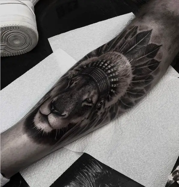 lion tattoo on the leg