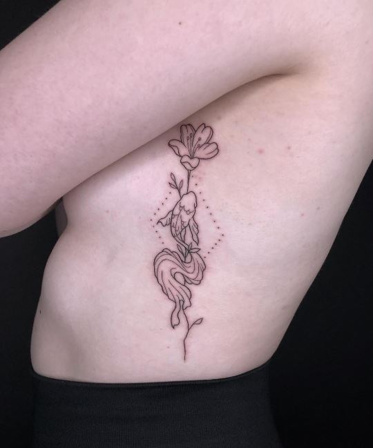lotus and fish sister tattoo