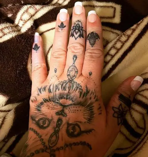 mandala style cat hand tattoo