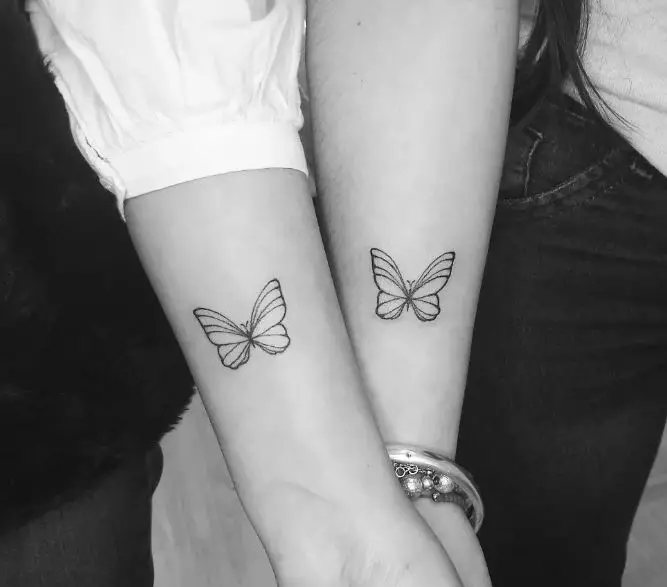 matching butterfly tattoos on the hand