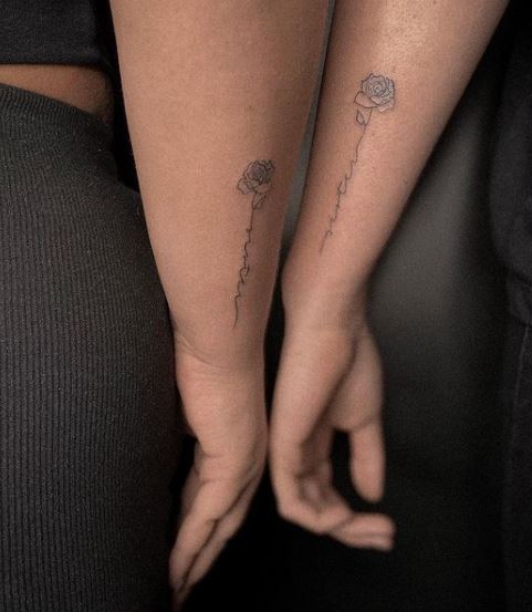 matching rose tattoos