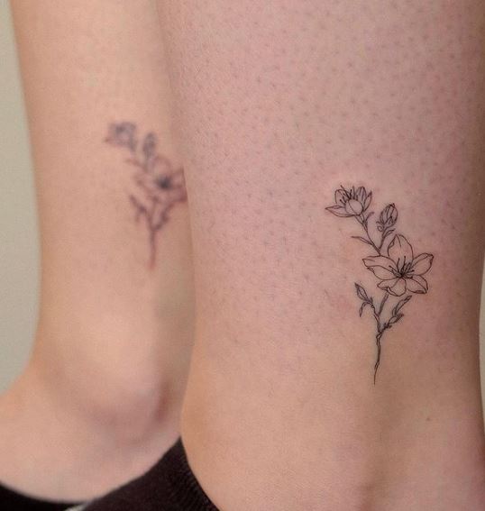matching sister tattoos on the ankles
