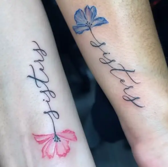 matching sisters tattoos in pink and blue