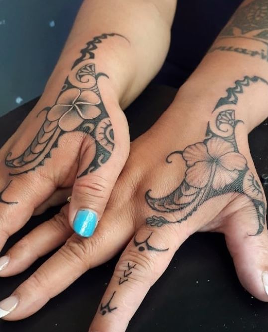 matching tribal hand tattoos