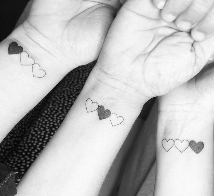 matching triple heart tattoos