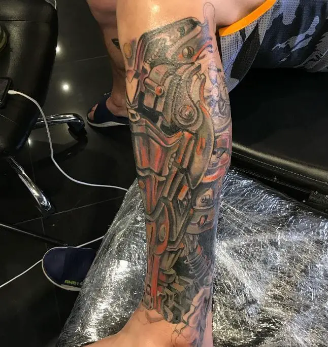 mechanical leg tattoo with a bit of colour