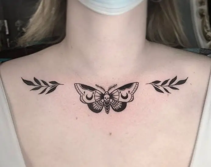 moth chest tattoo