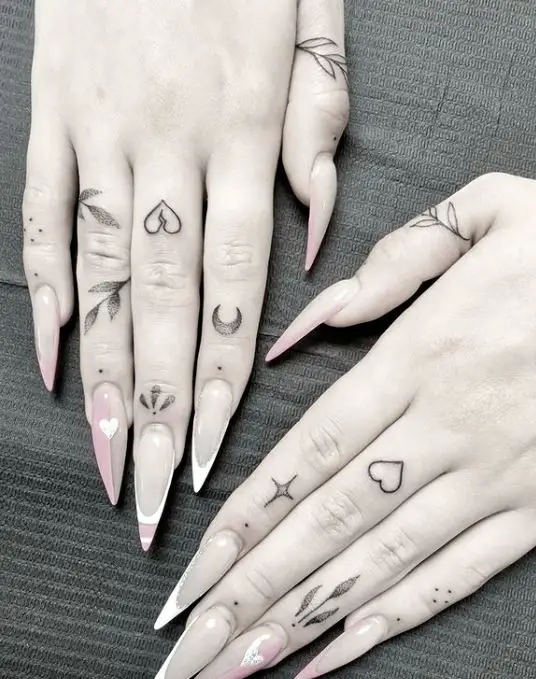numerous little finger tattoos