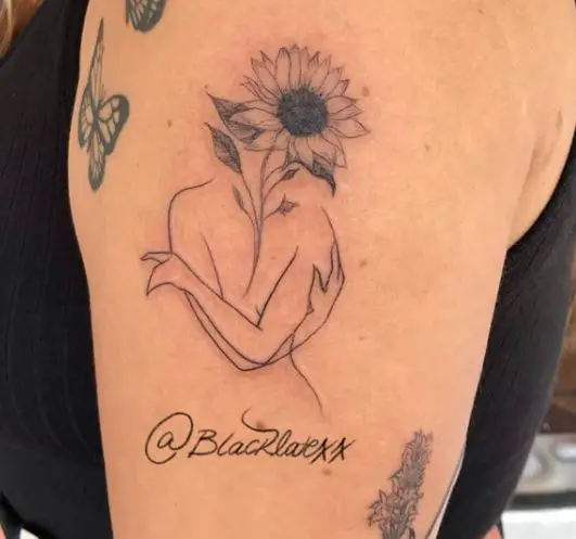 one sunflower on the head tattoo
