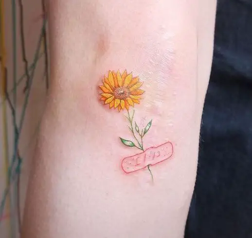 petite colourful sunflower tattoo